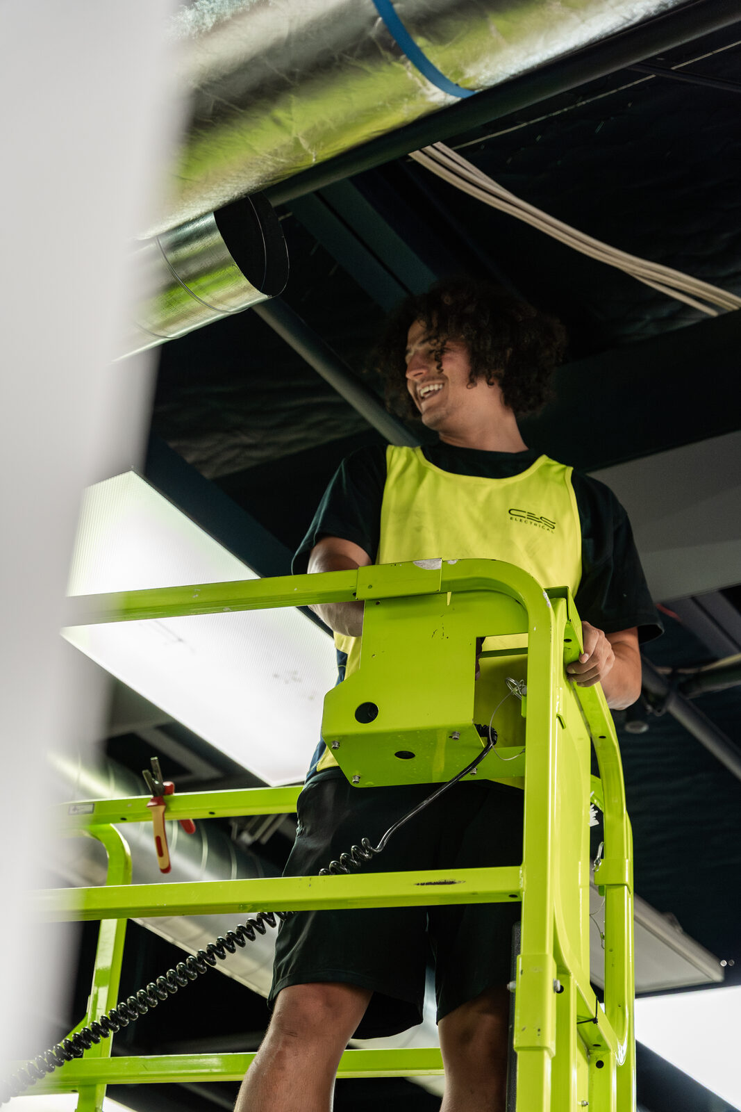 Electrician on elevated platform